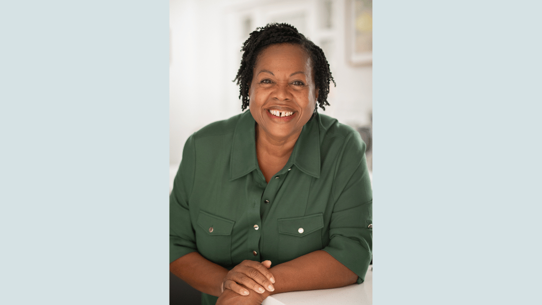 Smiling image of a woman welcoming engagement with you for coaching.
